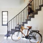 Granada Tile's Sofia cement tiles paves the front entryway of this home from photographer Marcia Prentice's book, How We Live