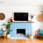 Granada Tile's Alhambra cement tiles cover a fireplace in a home seen on Apartment Therapy