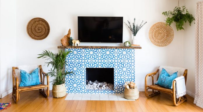 Granada Tile's Alhambra cement tiles cover a fireplace in a home seen on Apartment Therapy