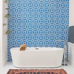 A wall of Granada Tile's Fez cement tiles make a strong statement in a modern bathroom