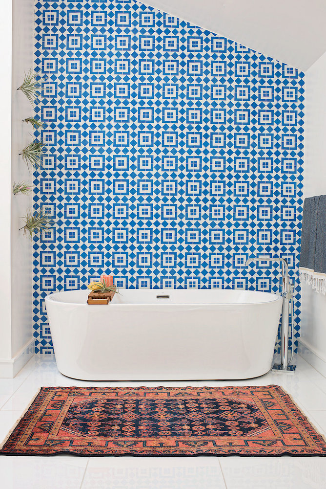 A wall of Granada Tile's Fez cement tiles make a strong statement in a modern bathroom