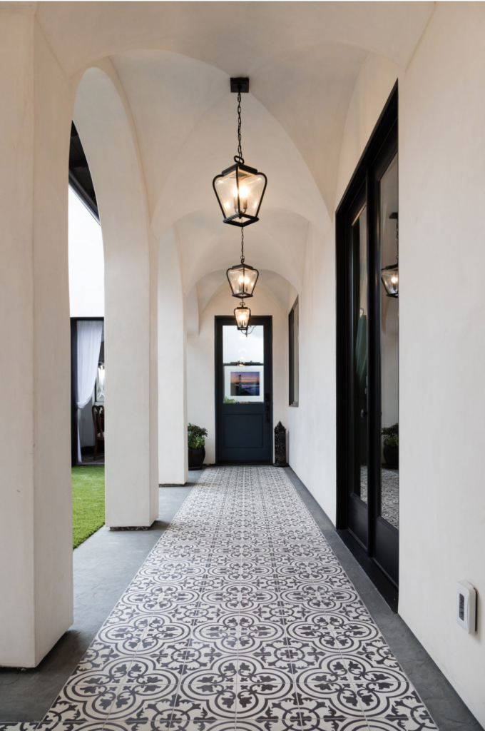 Cluny cement tiles in in-stock black and white encircle the courtyard of a Denton Developments project