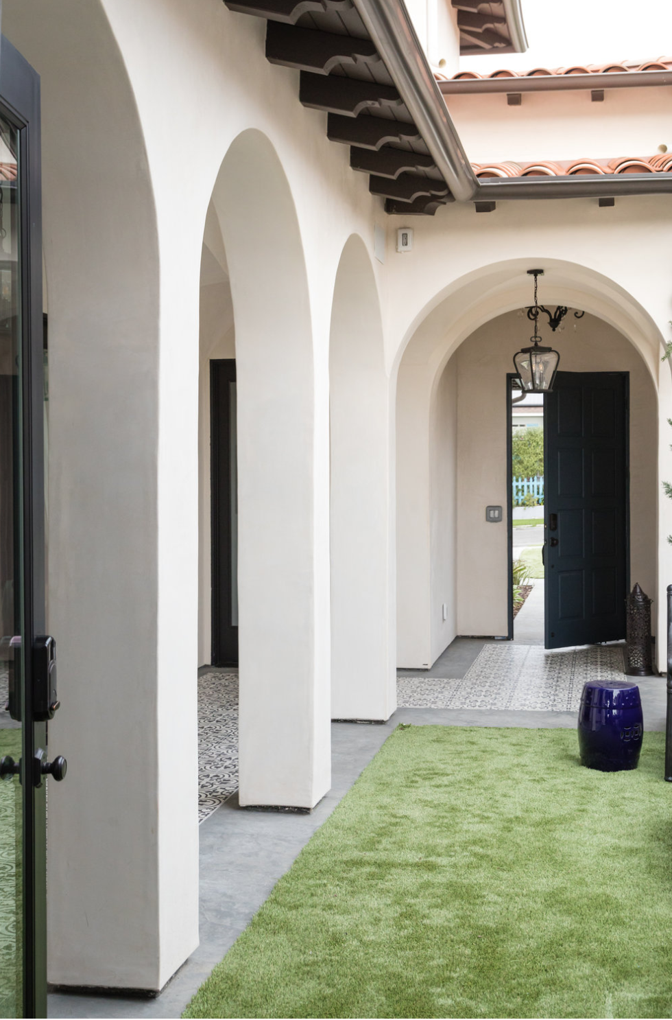 Cluny cement tiles in in-stock black and white encircle the courtyard of a Denton Developments project