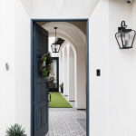 Cluny cement tiles in in-stock black and white encircle the courtyard of a Denton Developments project