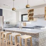 In a kitchen designed by ModOp and Better Shelter, Granada Tile's Madesimo cement tiles transform an all white space