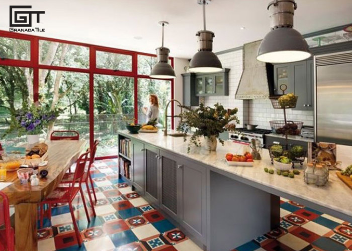 A kitchen with a patchwork tile design