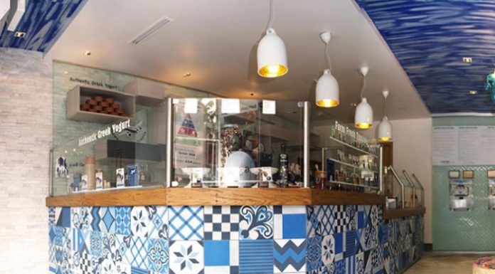 Blue, black, and white patchwork tile design in a Greek Yogurt business