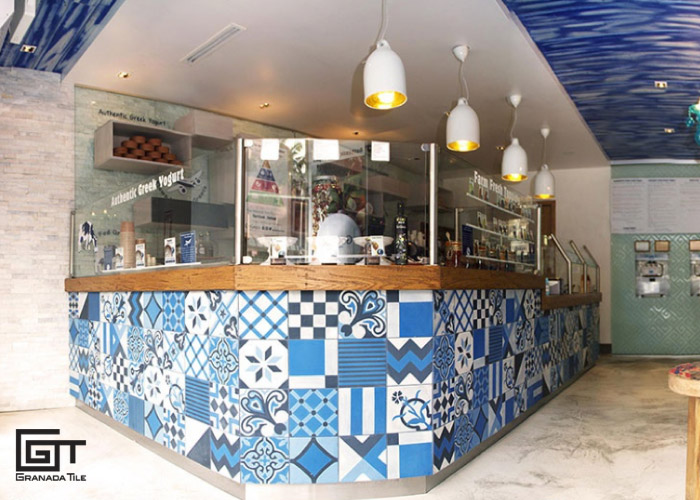 Blue, black, and white patchwork tile design in a Greek Yogurt business