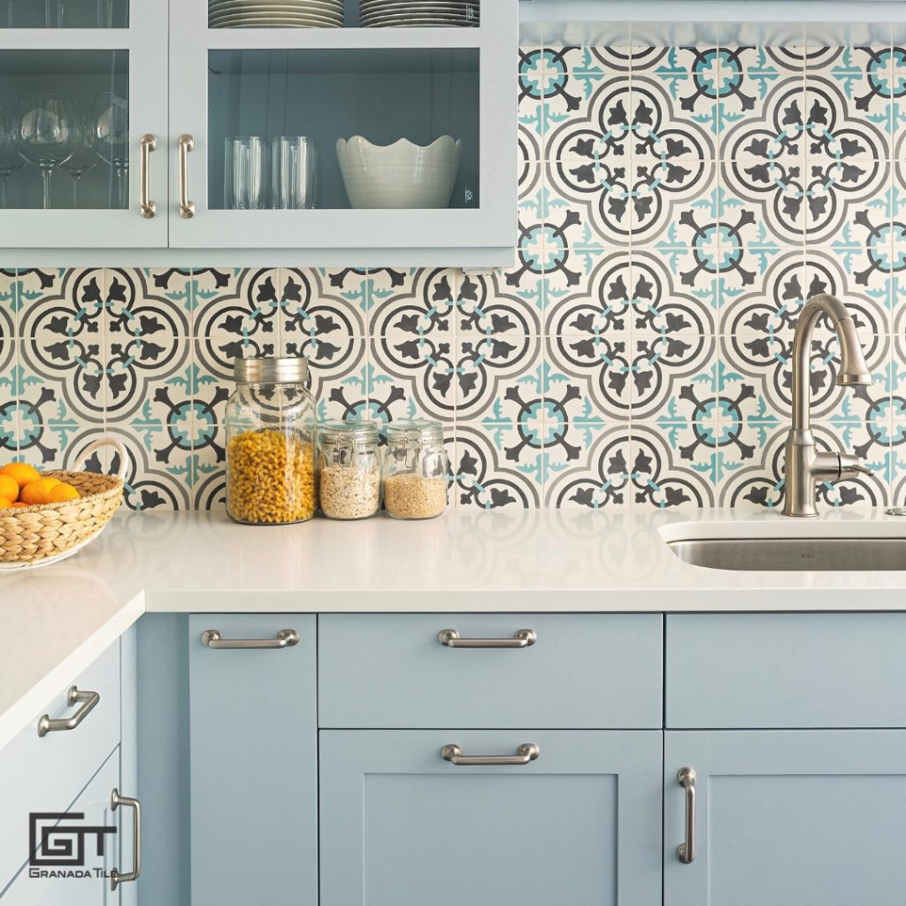 Cluny Cement Tile highlights the cabinetry in a pale blue kitchen