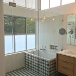 A bathtub area covered with Athens pattern from Granada Tile