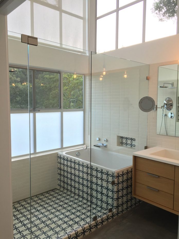 A bathtub area covered with Athens pattern from Granada Tile