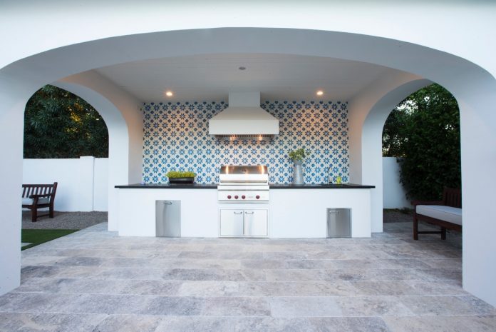 Granada Tile’s Calais pattern installed across an outdoor patio wall