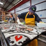 Light sanding of Copenhagen cement tile at Granada Tile factory in Nicaragua