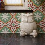 A Sofia pattern used as a kitchen backsplash with owls near it