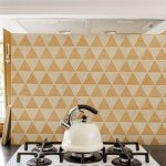 Kitchen stove with Equi tile background