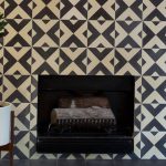 concrete fireplace with alternating X-patterns