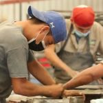 People cleaning cement tiles