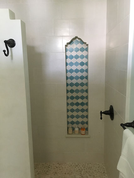 Granada Tile's Droplet design in bathroom shower niche in resort villa in Costa Rica