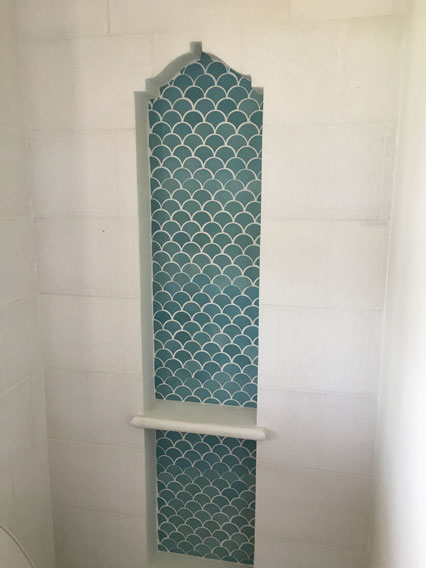 Granada Tile's Scale design in bathroom shower niche in resort villa in Costa Rica